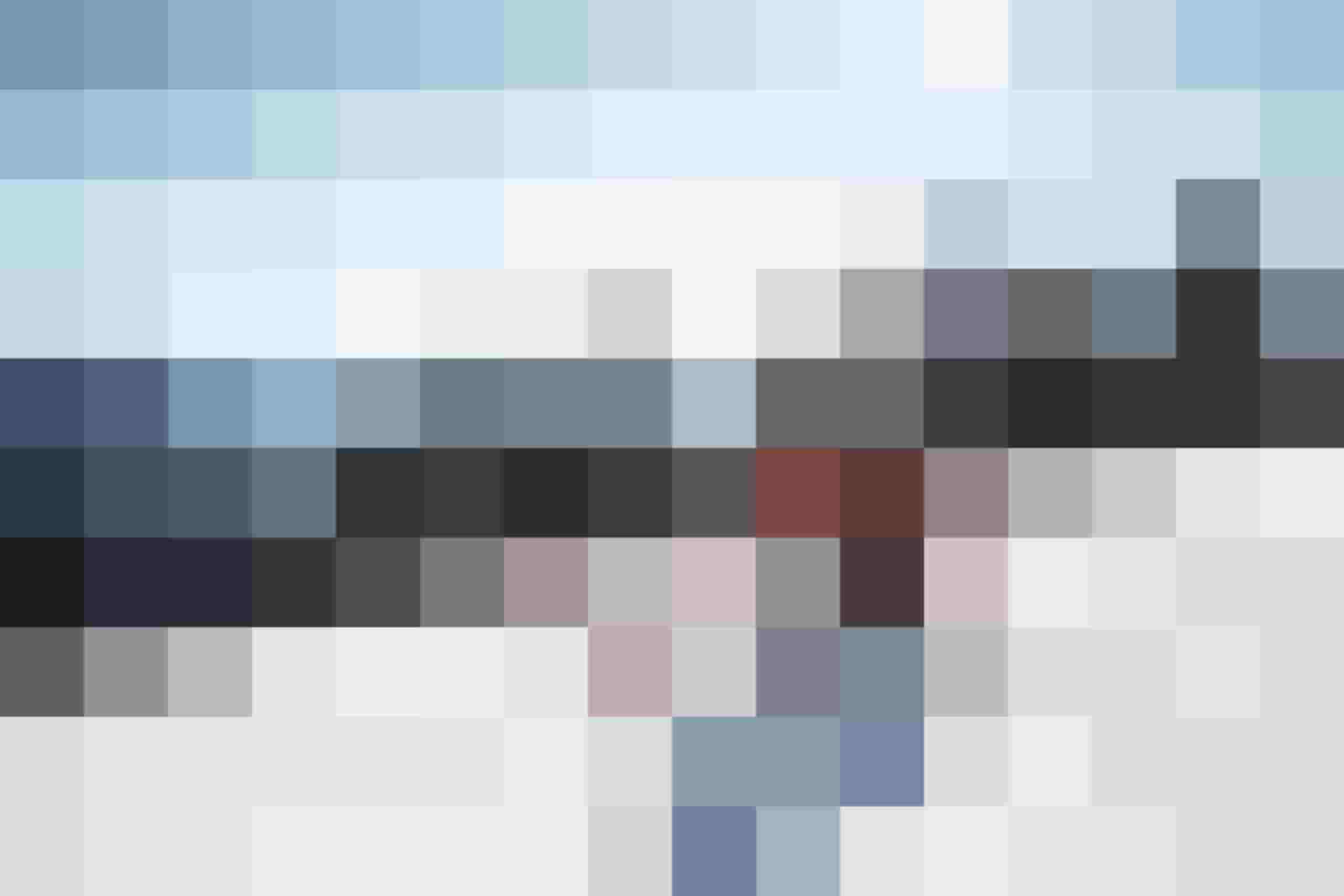 Skifahrer in orangefarbener Jacke auf sonniger Piste